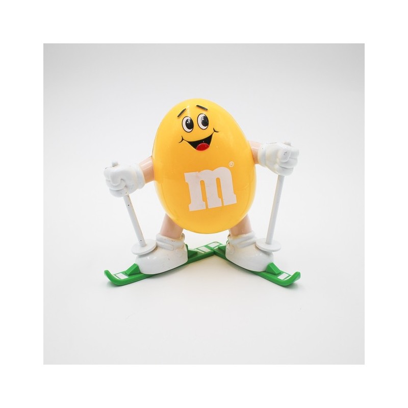 Distributeur M&M's jaune en ski