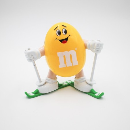 Distributeur M&M's jaune en ski